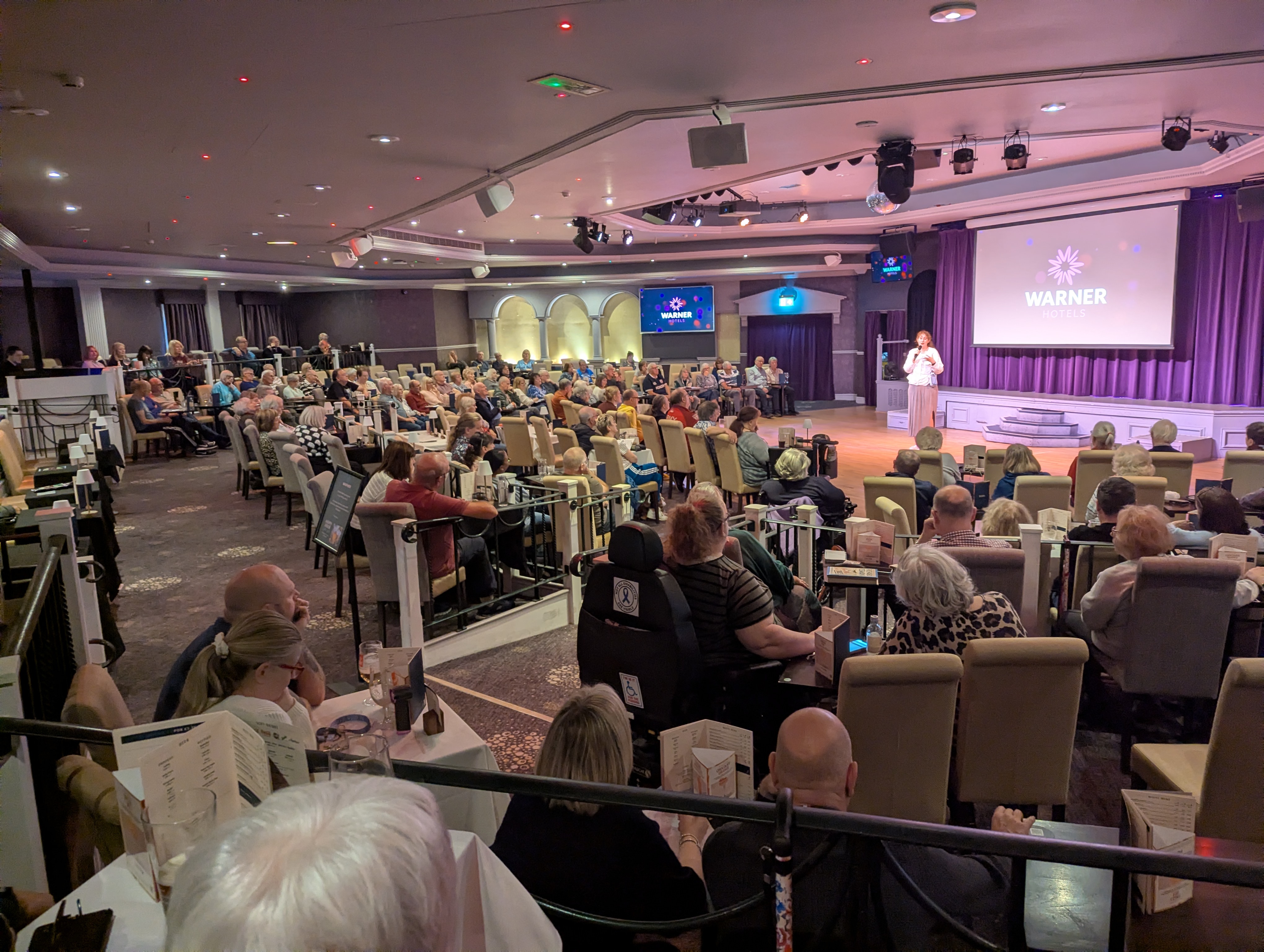 Guests watching an Alara murder mystery performance at Holme Lacy
